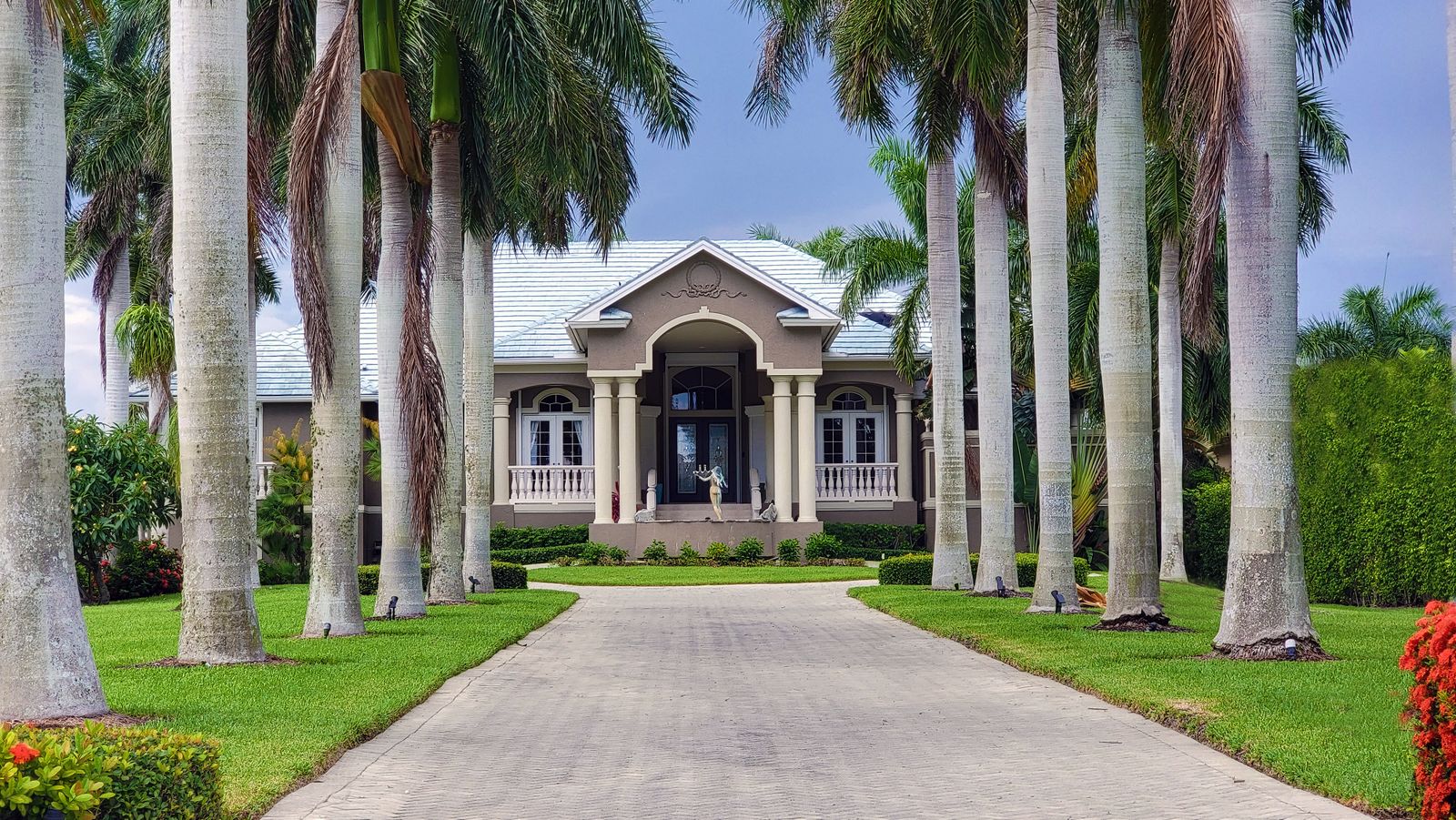 Florida home with palm-lined driveway in a Lake Nona-area community